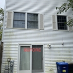 Before photo of townhome covered in algae