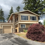 After-New siding, new stone, new deck, painting