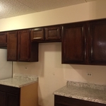 Refinished and installed cabinets