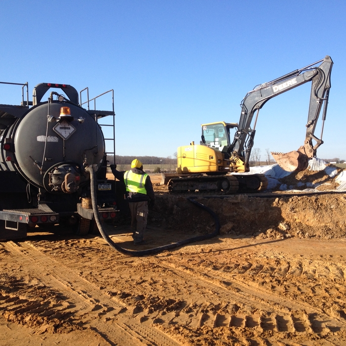 Vacuum Truck and Track Excavator