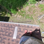 Gutter guards being installed