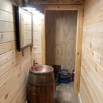 Custom copper barrel sink and pine walls/trim