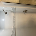 Neo-angle shower with mosaic accents