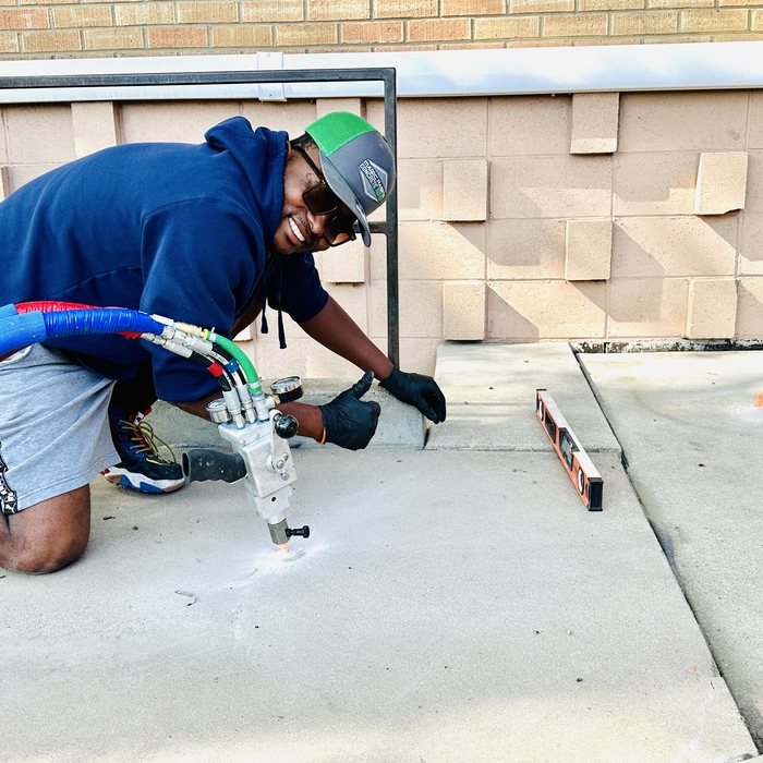 Concrete leveling in process
