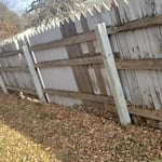stretch of fence before leaning and dry rotted