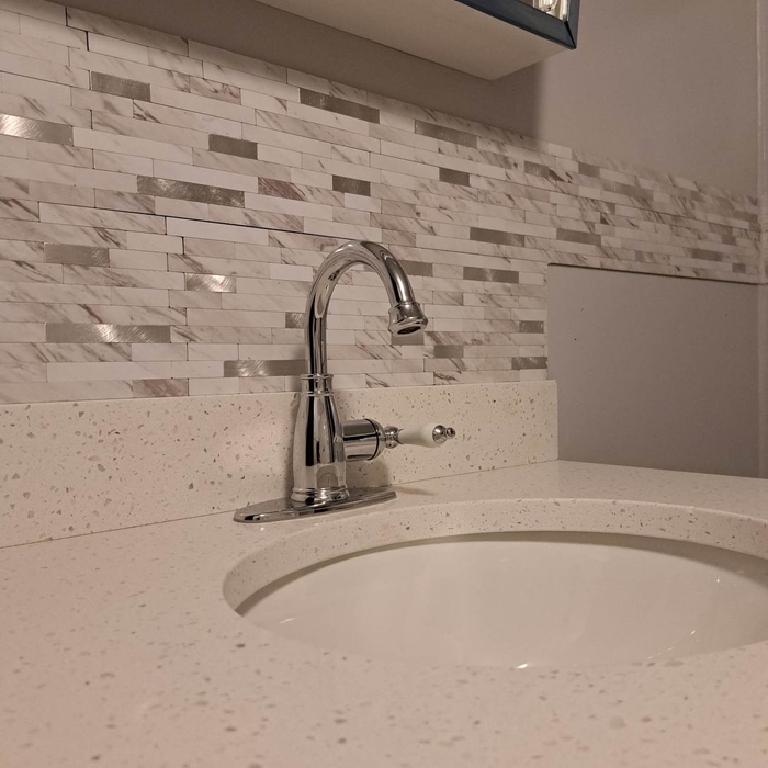 new faucet and tile backsplash