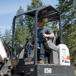 Matthew running the excavator