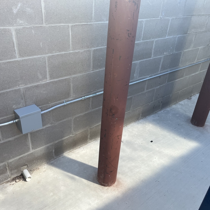 Inside of trash bin area conduit run.