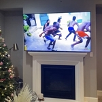 Tv above fireplace