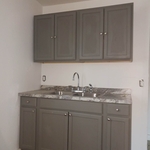 apartment kitchen cupboard and sink