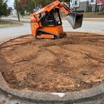 Grading &removing old roots before laying fabr