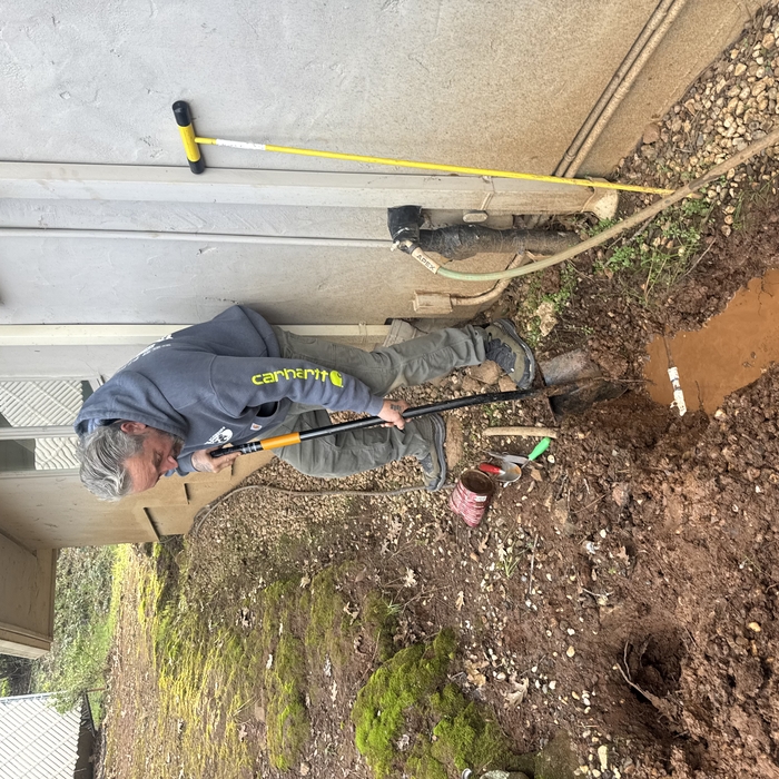 Owner fixing a pipe
