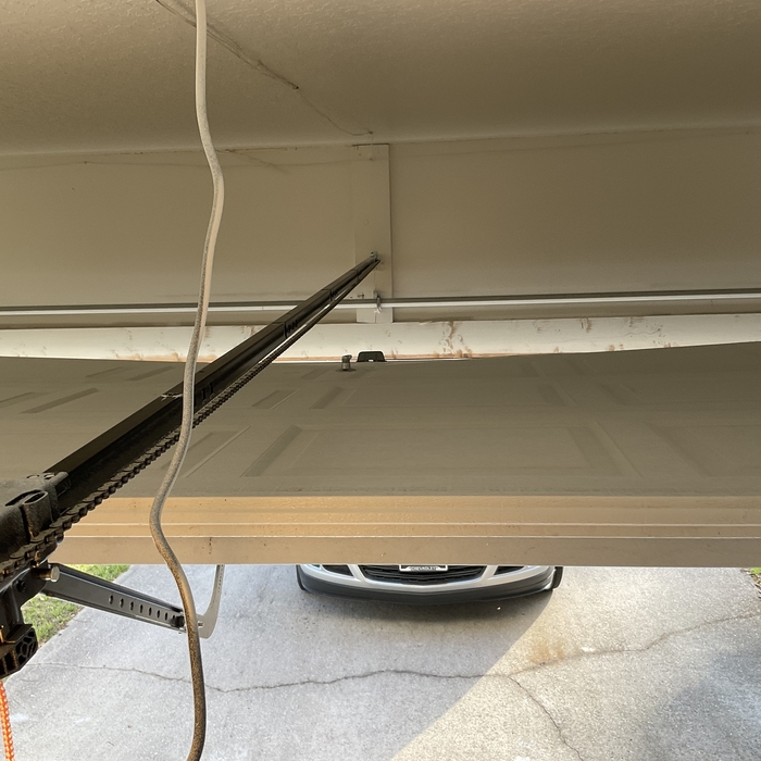 Before photo: Sagging Garage Door