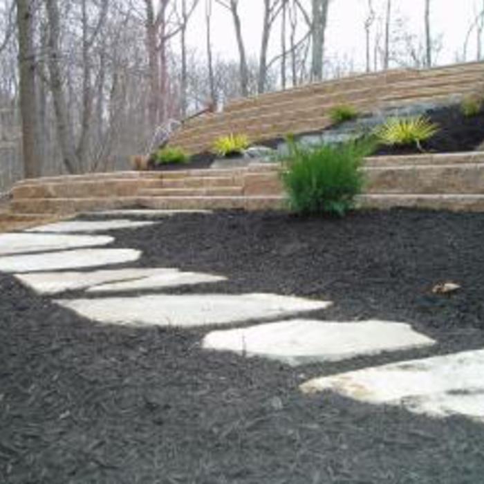 Retaining wall below driveway and steps