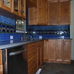 Blue mosaic tile backsplash