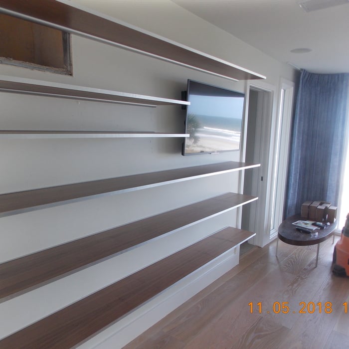 Cantilevered walnut and stainless shelves