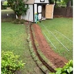 Trenching for electrical conduit.