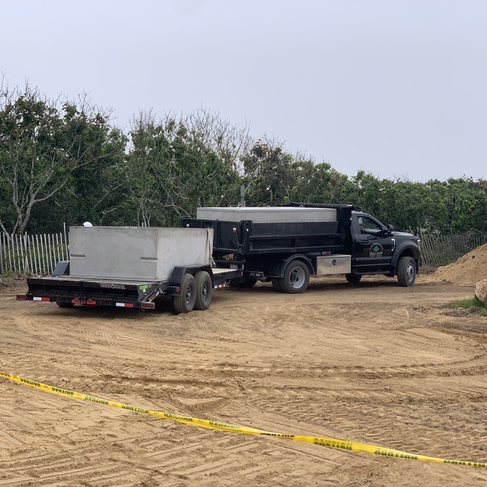 Dump truck and septic tank