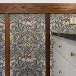 wallpaper, outlet plate, and trim by peninsula