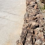 landscape moss rock on curb
