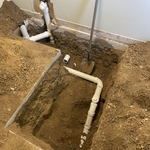 Bathroom addition below the concrete.