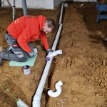 Tankless water heater drain discharge