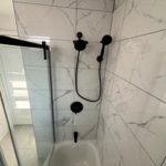 New shower with fixtures and shower door