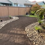 Garden and river rock and grass