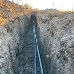 Water and communication line from well to house