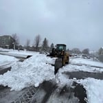 Loader moving snow