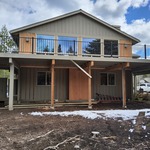 Progress photos of siding repair and deck beams