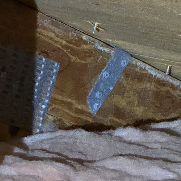 Roof to deck attachment