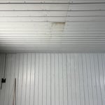 before wall/ ceiling inside shop