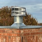 New flue cap and termination cover installed