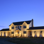 Modern Farmhouse with warm architectural lighting