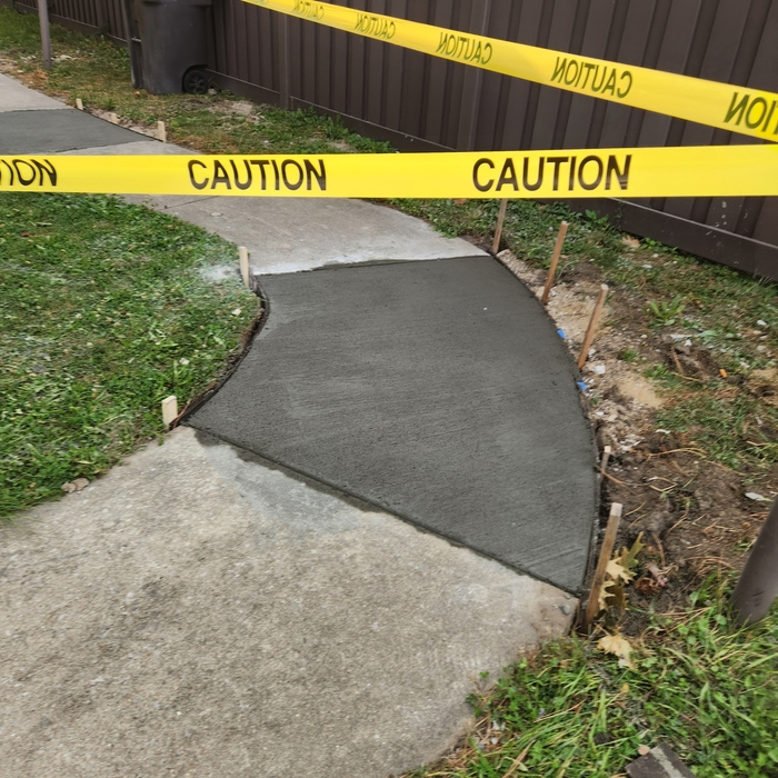 Curved public sidewalk installed
