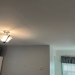 Repaired ceiling in bedroom after water leak.