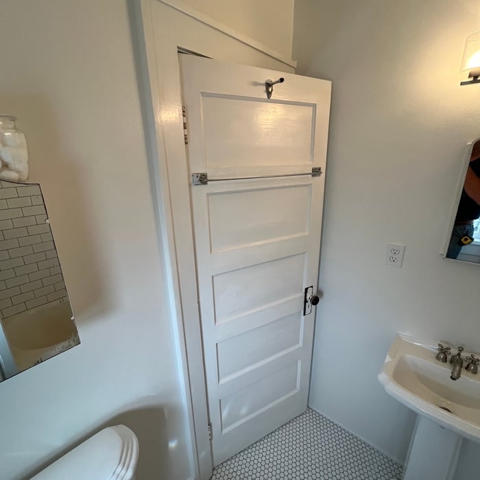Finished upstairs bathroom with new flooring and new plumbing fixtures.