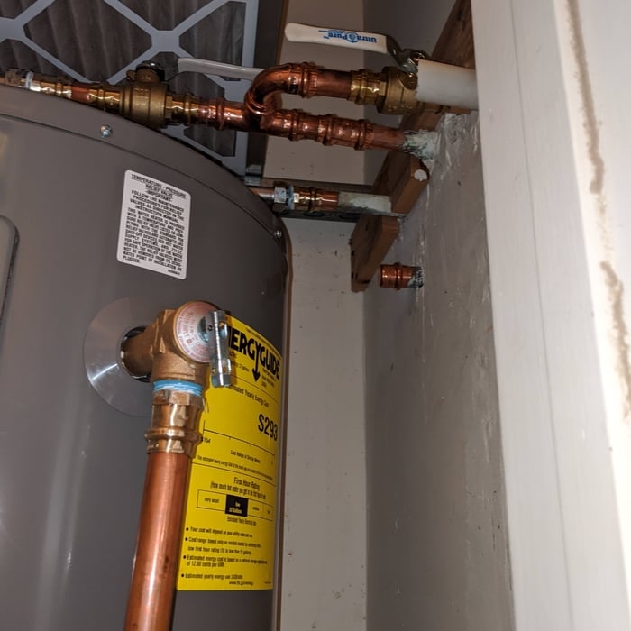 Water heater replaced underneath an air handler