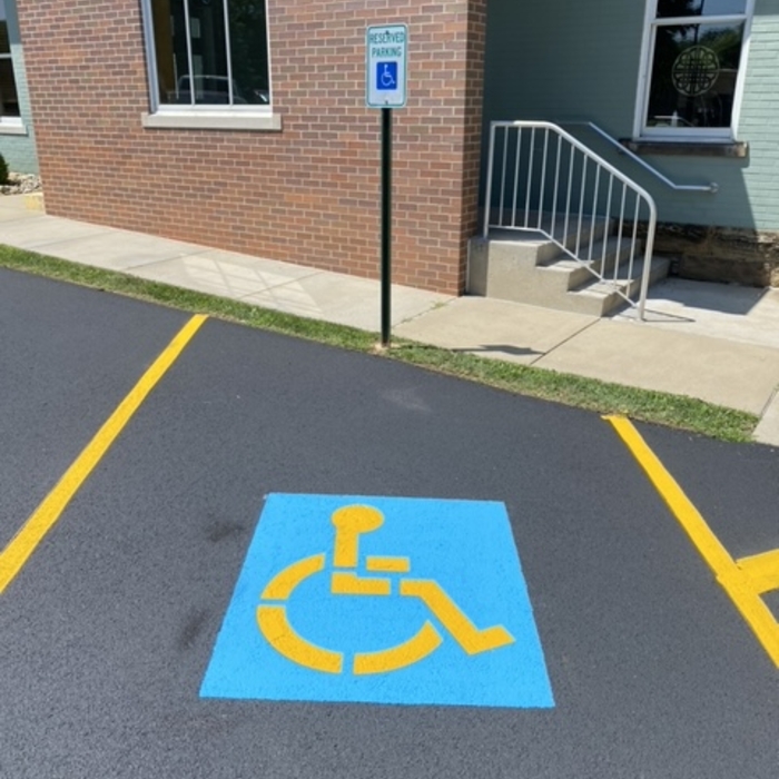 Seal coat, restripe and handicap stencil
