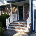 Brick and granite stone. PVC handrail.