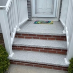 Brick and granite stone. PVC handrail.