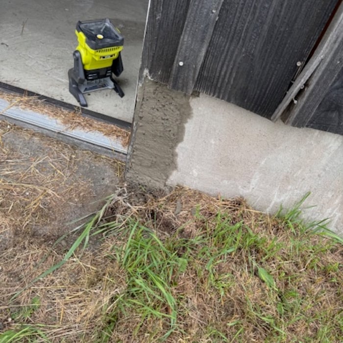 Cement hole patched to prevent rodent invasion