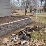 As you can see, her garage retaining wall gives her plenty of space to do her gardening