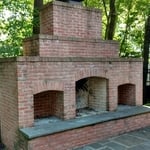 Backyard fireplace Before
