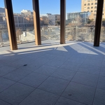 7th Floor Balacony - 1 inch thick Floating Buzon Ceramic Tile with aluminum frame handrail and 3/4 inch, thick glass infill wall