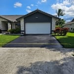 Coat asphalt drive way