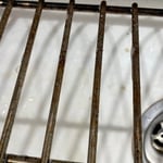Cleaning oven grates