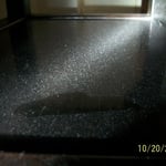 Construction/demolition work in an apartment unavoidably released high levels of dust that migrated into adjacent apartments. Dust containment methods, such as negative air filtration and poly sheeting, should have been used to prevent dust migration into adjoining spaces. Settled dust samples were collected from a table & curtain rod in a nearby apt, which revealed the presence of substantially elevated levels of silica and asbestos in the dust. Asbestos and silica are known carcinogens.
