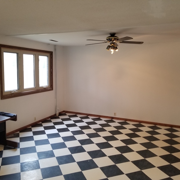 Matched existing flooring as well as repairing and finishing drywall on walls and ceiling due to moisture. Also finished the baseboard trim, trim around windows, and painted the entire room.